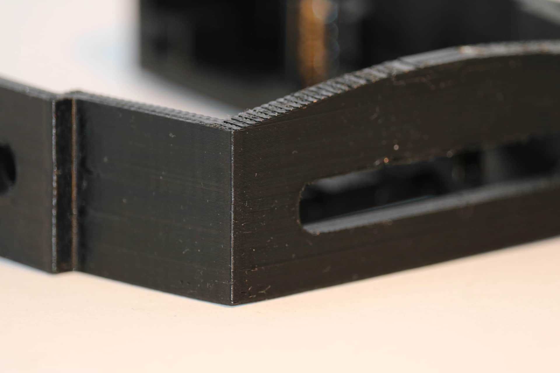 3D printed part — strap slots and precision fit